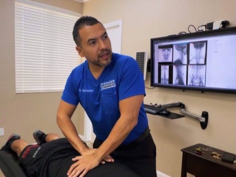 Dr. Jesús Cazares adjusts a patient's back at Premier Chiropractic in Stockton